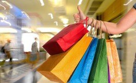 Female holding shopping bags at shopping mall